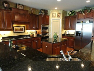 Other features, lots of counter space, deep dbble stainless sink, can lighting and shiny hardwood floors.