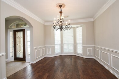 The formal dining room is large enough for an oversized table to comfortably host your dinner parties.
