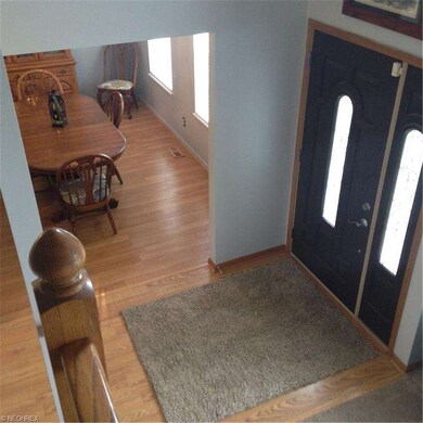 Looking down into the foyer and formal dining room