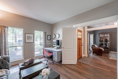 Double doors open to entry and dining, giving an o