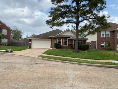 Charming brick home with a lush front lawn in a pe