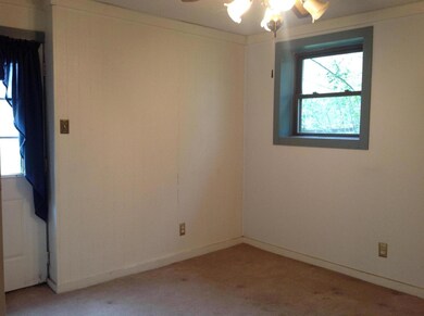 Den/ Mud Room with door to wood patio