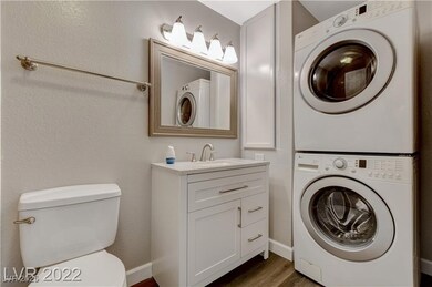 Laundry room featuring stacked washer / drying mac