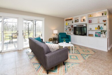 Living room off the kitchen with built-ins and a g