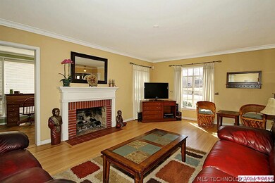 Living area with fireplace and adjoining sunroom