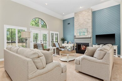 Family room has soaring ceiling with updated floor