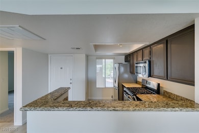Kitchen featuring stainless steel appliances, ligh