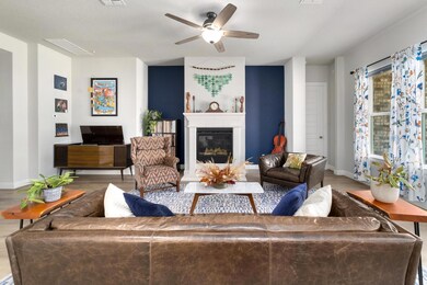 Accent walls flank the stylish fireplace