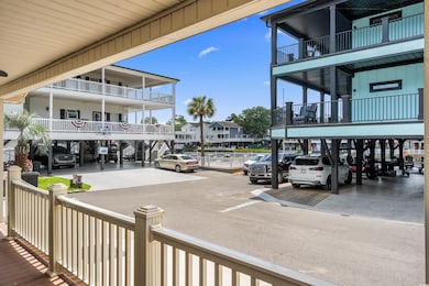 View of community featuring uncovered parking