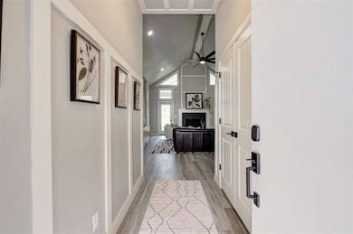 Corridor featuring light wood-type flooring, a tow