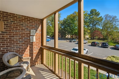 Extended living space with a screened-in balcony accessed from family room-living room. (other side of balcony has a door to a storage room.)
