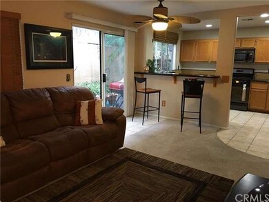 Living room leads to kitchen & patio 