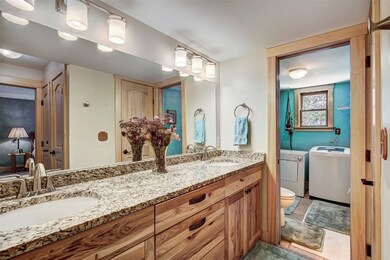 Primary bathroom featuring custom vanity with doub