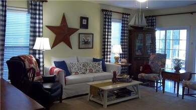 Large living room with lots of natural light.  This floor plan flows so well.