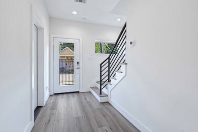 Garage, Entry and Staircase View from Bedroom/Stud