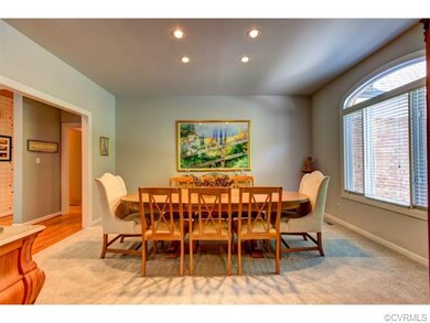 The dining room faces the front of the home with r