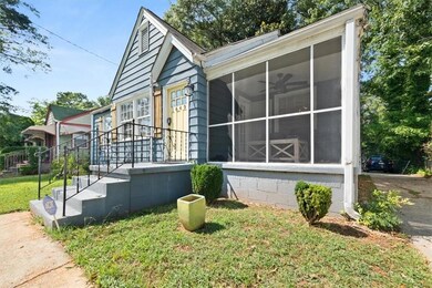 View of property front entry and screened porch