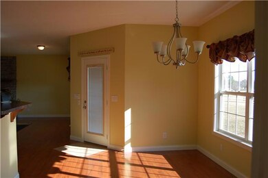 Dining room is bright and sunny with access to covered porch.