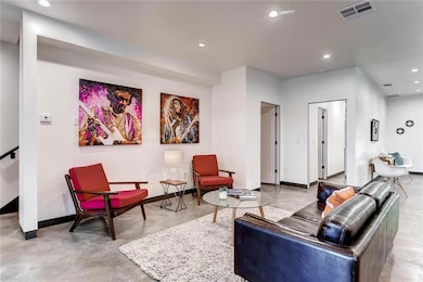 Living area with finished concrete flooring, base