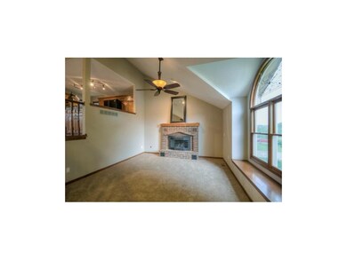 Vaulted Living Room with Brick Fireplace.