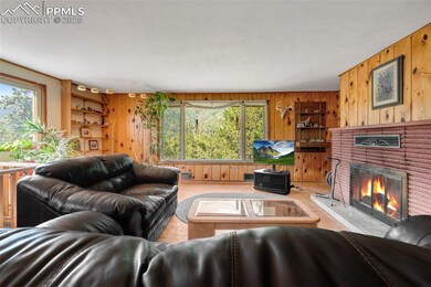 Living room featuring 2 large windows with views and built-in shelving
