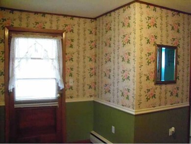 Foyer. Entryway leading from front sitting porch t