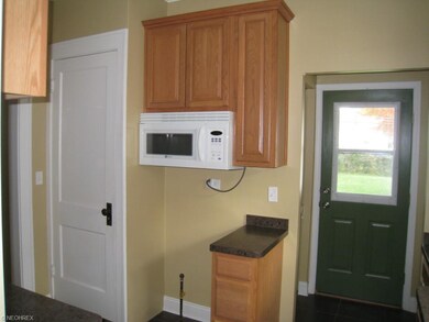 Kitchen, back door and door to dormer bedroom upst