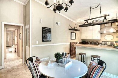 The dining area opens up to the bedroom and bathro