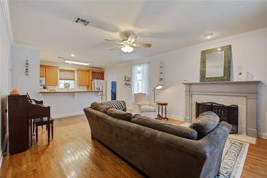 Greatroom with hardwood floors is open to Kitchen