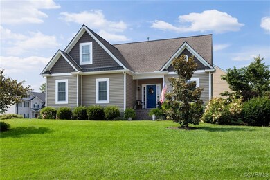 Craftsman inspired home featuring a front lawn