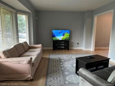 Living room featuring wood finished floors and baseboards