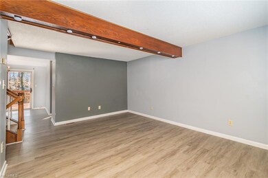 Living room is spacious with accent wall and newer LV flooring throughout main level.