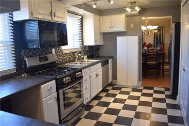 Kitchen- Updated backspash, lighting, counters, an