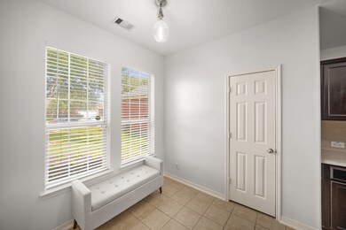 The breakfast area features, tile flooring, pendan