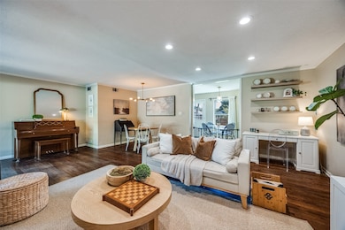 Enclosed garage expanded the living room to allow for generous seating, dining and office space.
