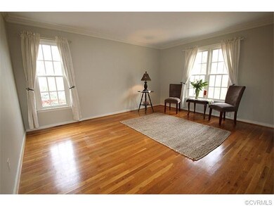Formal living room, hardwood floors, neutral tone 
