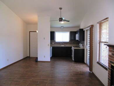 View of front door and open floor plan that showca