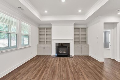 Expansive Family Room with custom bookcases