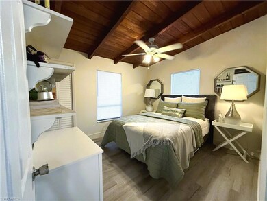 Bedroom featuring multiple windows, wooden ceiling