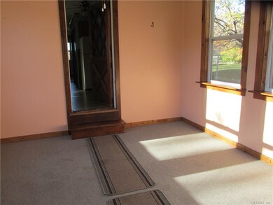 enclosed porch leading to kitchen