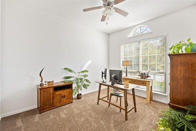 Upon entering, Office features carpet, ceiling fan
