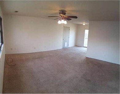 Front door looking to garage and backyard
