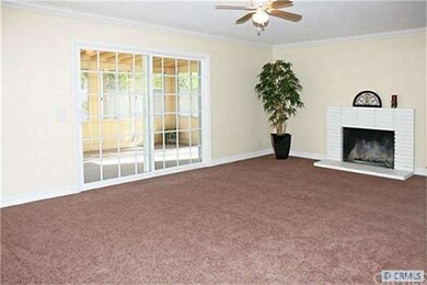 Large Living Room with Ceiling Fan & Fireplace Ope