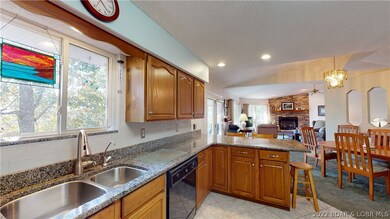 Open to dining and living areas with extra bar sea