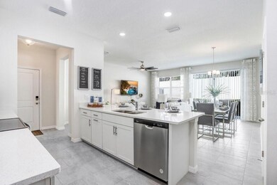Kitchen Overlooking Dining/Living Area (photo of model home)