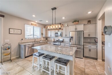 Kitchen with light stone countertops, a kitchen ba