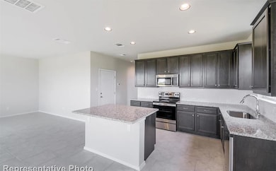Kitchen featuring appliances with stainless steel