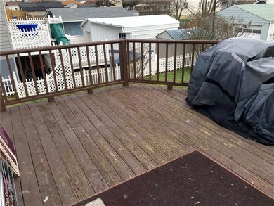 Elevated Rear Deck.  Notice the fenced in Back Yar