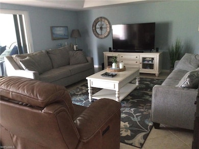 Living room with 2 leather remote recliners