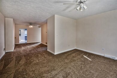 The very open living room and dining room is a per
